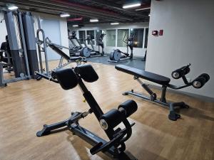 a gym with lots of exercise equipment in it at Willow Nest in Bacolod