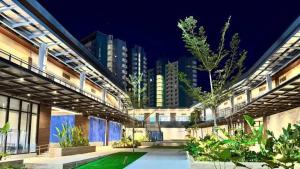 a courtyard of a building with trees and plants at Willow Nest in Bacolod