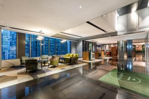 a lobby with a view of the city at Holiday Inn Guangzhou Zhujiang New Town in Guangzhou