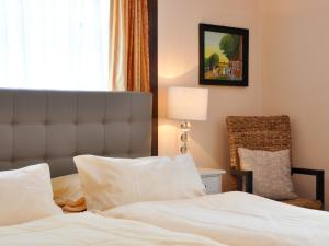 Postel nebo postele na pokoji v ubytování Hotel Gregory Wyk auf Föhr