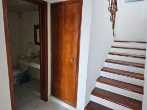 a stairway leading to a bathroom with a stair case at Cantamar 401, huge condo , incredible views in Cozumel +16 photos
