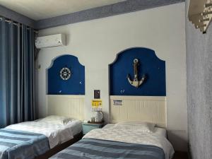 Postel nebo postele na pokoji v ubytování PI Network Inn