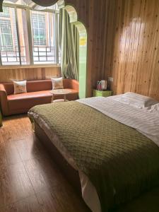 Postel nebo postele na pokoji v ubytování PI Network Inn