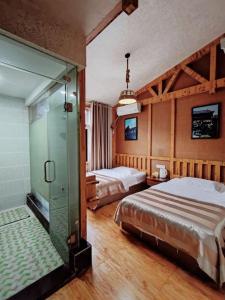Postel nebo postele na pokoji v ubytování PI Network Inn