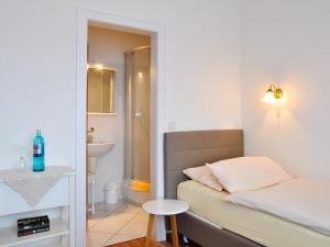 Postel nebo postele na pokoji v ubytování Hotel Gregory Wyk auf Föhr