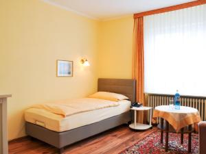Postel nebo postele na pokoji v ubytování Hotel Gregory Wyk auf Föhr
