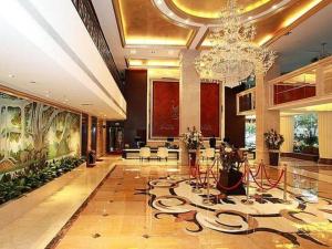 a large lobby with a chandelier in a building at Yunhai Hotel Zhuhai in Zhuhai