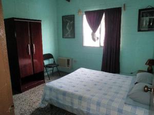 Säng eller sängar i ett rum på Guesthouse Dos Molinos B&B