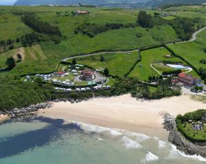 an aerial view of a beach with a resort at Hotel Playa La Arena in Isla