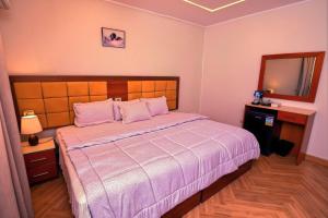 Letto o letti in una camera di THree PYramiDs & SPhinX HoTeL