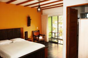 Letto o letti in una camera di Hotel Portobelo Guatape