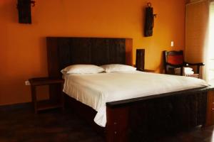 Letto o letti in una camera di Hotel Portobelo Guatape