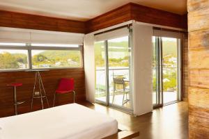 Letto o letti in una camera di Hotel Portobelo Guatape