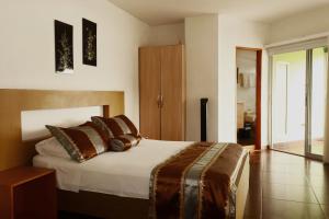Letto o letti in una camera di Hotel Portobelo Guatape