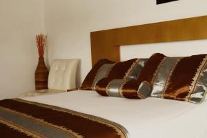 Letto o letti in una camera di Hotel Portobelo Guatape