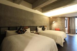 Uma cama ou camas num quarto em MZ 1090 B&B