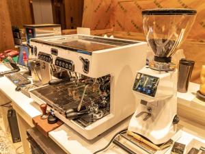 a blender sitting on top of a counter at James Joyce Coffetel Tianjin Railway Station in Tianjin