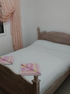 En eller flere senge i et værelse på Villa Avdira