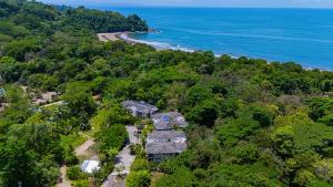 an aerial view of a house in the woods next to the ocean at Elan at Ballena Beach in Uvita