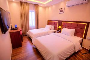 Letto o letti in una camera di THree PYramiDs & SPhinX HoTeL