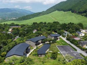 an aerial view of a village with houses and mountains at Rakuten STAY Hakone Susuki Grass Fields in Sengokuhara