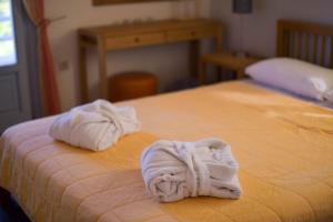 Ένα ή περισσότερα κρεβάτια σε δωμάτιο στο Σειρίη