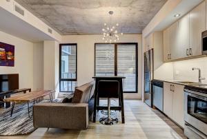 a kitchen and dining room with a table and chairs at The Downtown Oasis in Montréal +15 photos