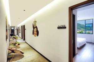 Χώρος καθιστικού στο Wolong Yunshang Four Seasons Panda Inn