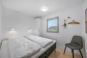 Ένα ή περισσότερα κρεβάτια σε δωμάτιο στο Lovely Holiday Home, Renovated In 2025, Located Only 800 Meters From The North Sea