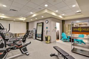 a gym with treadmills and machines in a room at Home2 Suites by Hilton Green Bay in Green Bay