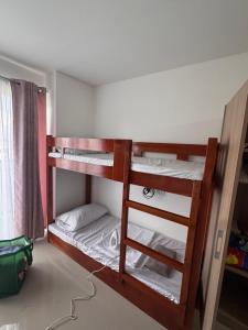 a bunk bed room with two bunk beds at 6 beds condo unit in Bernwood Tower in Iloilo City