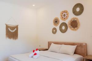 Postel nebo postele na pokoji v ubytování Bramasa Ubud Guest House
