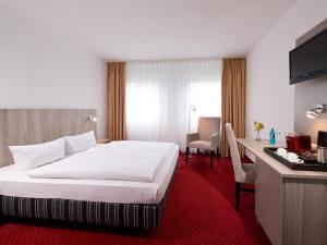 Postel nebo postele na pokoji v ubytování ACHAT Hotel Frankenthal in der Pfalz