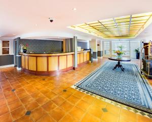 a lobby with a bar and a reception desk at City Lodge Hotel GrandWest in Epping