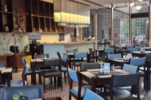 Een restaurant of ander eetgelegenheid bij @HOM Premiere Timoho