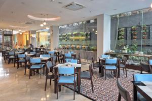 Een restaurant of ander eetgelegenheid bij @HOM Premiere Timoho