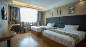Ένα ή περισσότερα κρεβάτια σε δωμάτιο στο GreenTree Inn Taizhou Gaogang District Business Hotel