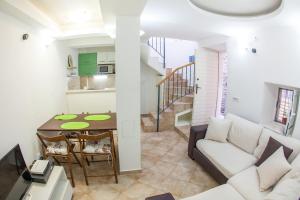 a living room with a couch and a table at Apartments Old Town in Budva