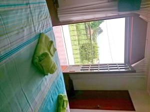 a view of a window in a bathroom with a towel at CasaRada in Carreço