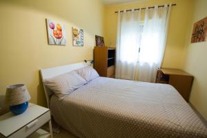 Ένα ή περισσότερα κρεβάτια σε δωμάτιο στο Lunetta