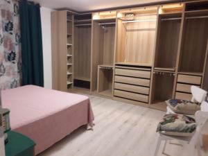 a bedroom with a bed and some closets at alloggio turistico ORTENZIE in Viterbo