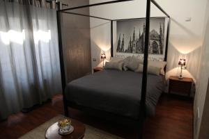 Posteľ alebo postele v izbe v ubytovaní Atmos Luxe Navigli