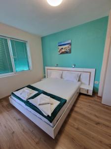 A bed or beds in a room at Exotic Guest House