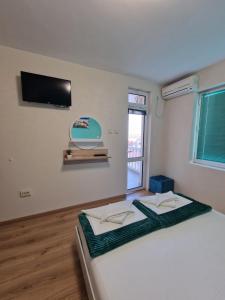A bed or beds in a room at Exotic Guest House