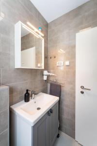 a bathroom with a sink and a mirror at Three Seas in Maslenica +26 photos