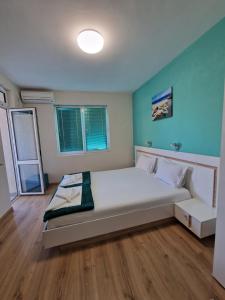 A bed or beds in a room at Exotic Guest House