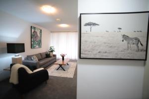 Televiisor ja/või meelelahutuskeskus majutusasutuses Wild Luxe Apt - Southbank & Fast WIFI Parking