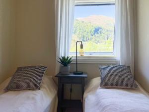 Ένα ή περισσότερα κρεβάτια σε δωμάτιο στο 12 person holiday home in Davik