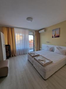 A bed or beds in a room at Exotic Guest House