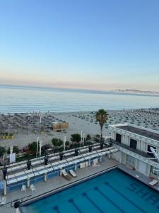 a view of the beach from the balcony of a resort at SunKissed Apartament in Golem